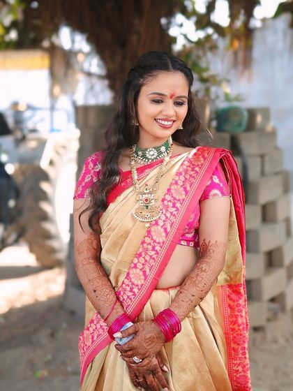 A close up of the bride's happy expression during her Ganesh Poojan.