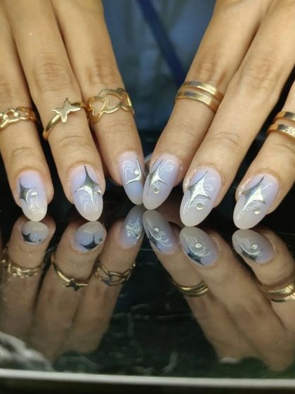 A futuristic design with chrome starbursts on a shimmery, light purple base.