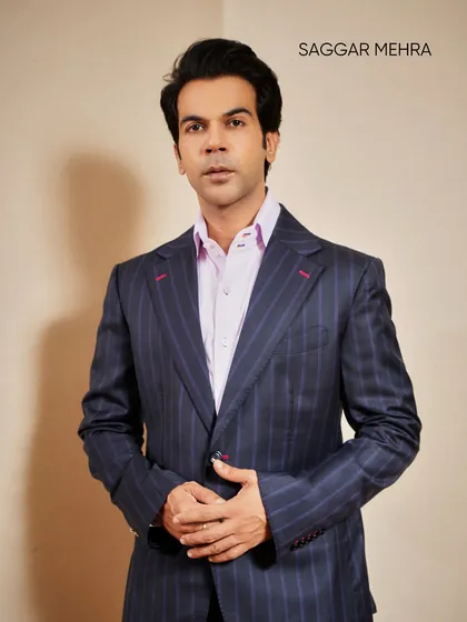 Actor Rajkummar Rao in a bespoke pinstripe suit. This highlights the core of my craft: impeccable tailoring that fits like a second skin, elevated by subtle details like the contrast red stitching on the buttonholes for a signature edge.