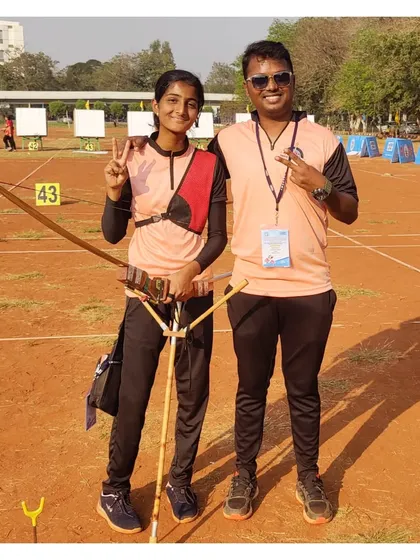 A victory pose with one of our students after she won a team gold medal at the National Archery Championship in Vijayawada.