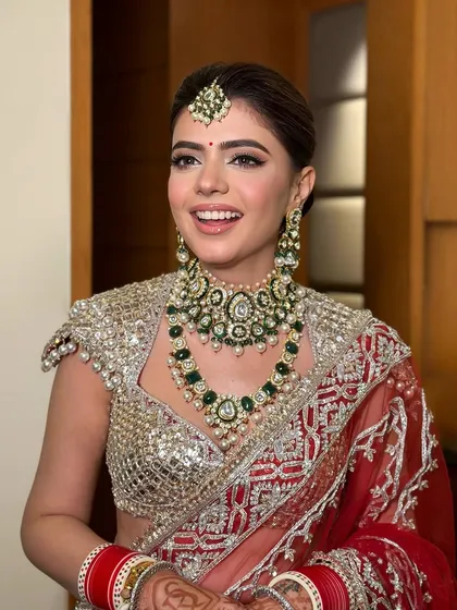 The joy of a bride on her wedding day. Her smile says it all, and the makeup is there to make sure she feels as beautiful as she looks.