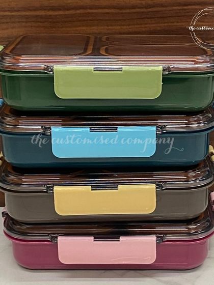 Make lunchtime magical with our custom bento-style lunch boxes. Available in a variety of colors, these durable boxes keep food fresh and organized for school.
