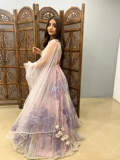 This pink and purple ombre lehenga is a playful and modern choice for a sangeet or reception.