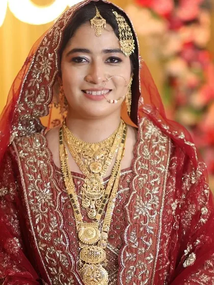 A smiling portrait of my Nikah bride. The makeup is designed to be radiant and enhancing, focusing on her beautiful smile and bright eyes.