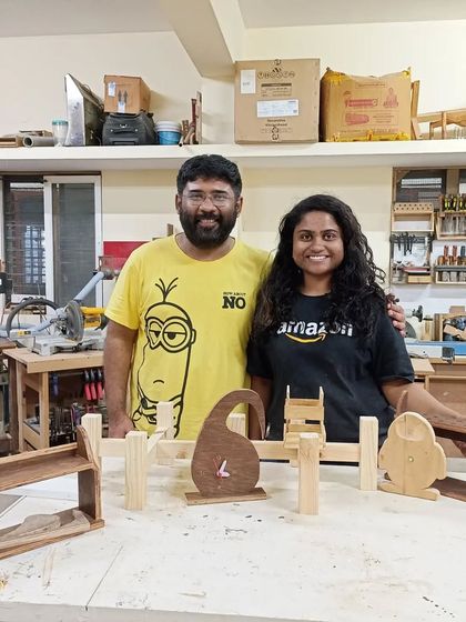 Priyanka and Raj with all the projects they completed during their Basic Carpentry Workshop. They made shelves, clocks, and planter stands.