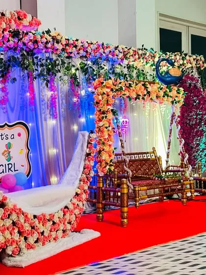 This elaborate baby shower decoration was set up on a terrace in Dombivli. It features a floral moon seat, a decorated jhula, and a custom photo backdrop, showing how I can transform any space into a beautiful venue.