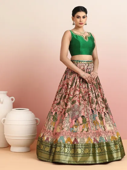 A view of the mythological print lehenga without the dupatta, allowing the detailed skirt and elegant green blouse to shine.