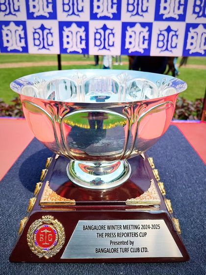 The Press Reporters Cup, a wide silver bowl with intricate detailing.