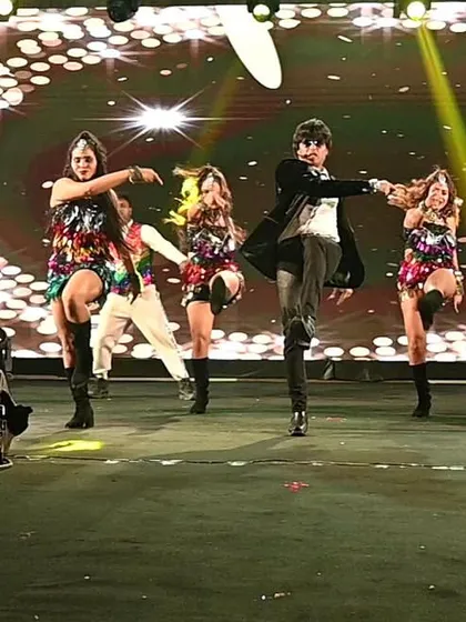 A synchronized dance move with the team. The precision and energy are what set our corporate shows apart.
