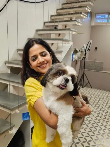 This is me with a freshly groomed Shih Tzu, one of our many happy clients. I believe in a hands-on approach, ensuring every pet that walks through our doors feels safe, loved, and leaves looking their absolute best. This personal connection is at the heart of Barks In The Town.
