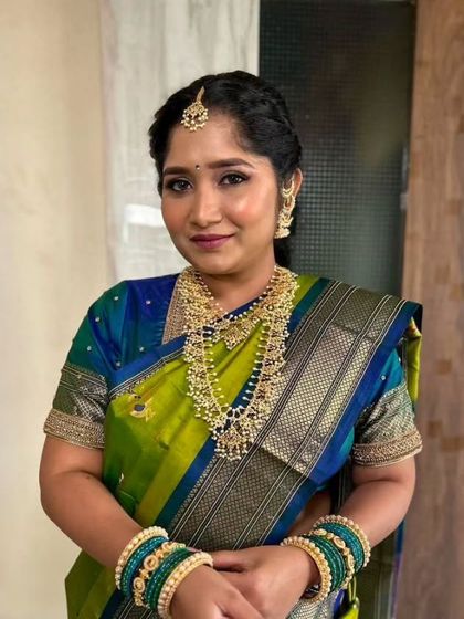A smiling portrait of the bride-to-be. Her traditional attire and radiant makeup make for a perfect engagement photo.