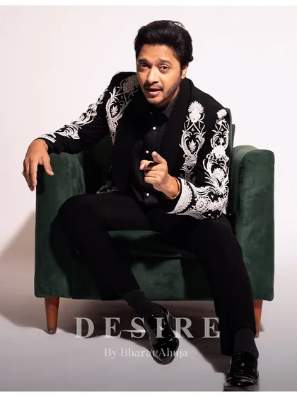 Engaging and direct, this image highlights the powerful presence this custom embroidered blazer commands. It's more than an outfit; it's an attitude.