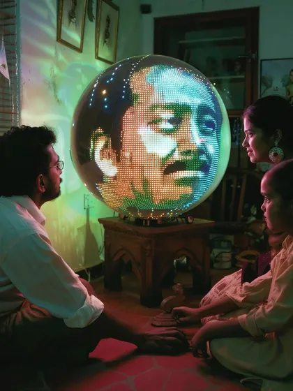 Another scene with the 'Chakraview', this time displaying a man's face. The mystery of its function is a key part of the storytelling.