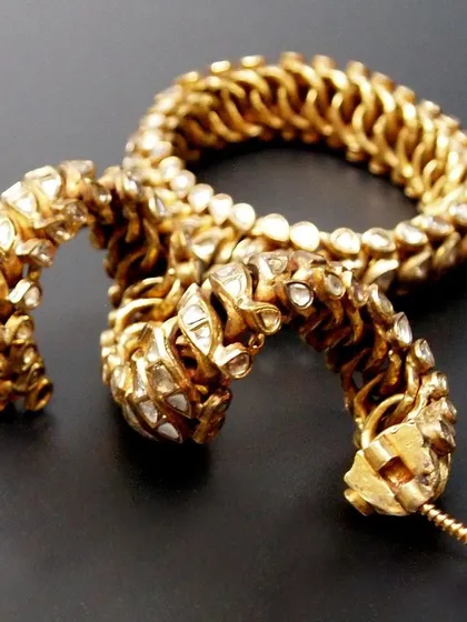 The unique flexible construction of these royal bangles is visible here. This design allowed for comfort while displaying the wealth and status of the wearer. A true piece of history.