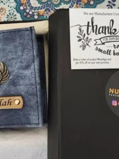 This personalized denim wallet with an angel wings charm is packed in a gift box with a special 'Thank You for supporting small business' note.