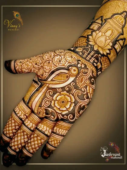 A detailed close-up of a design for the groom's sister, featuring a parrot on the palm surrounded by floral patterns. The wrist shows a dome, adding a touch of royal architecture.