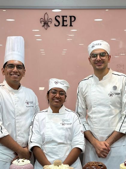 Posing with my mentors and fellow chefs on graduation day. It was an honor to learn and grow alongside such talented people.