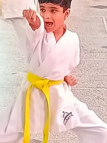 The focus and spirit of a young student during his belt grading test. This is what karate is all about: building discipline and a strong mind from an early age.