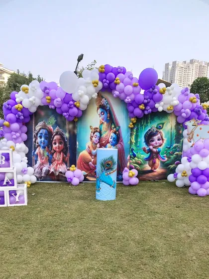 Another view of the outdoor Krishna-themed baby celebration.