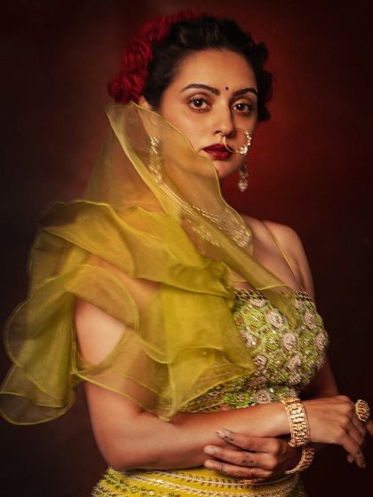 A dramatic shot of Shruti Marathe, with the ruffled dupatta creating a sense of mystery and elegance.