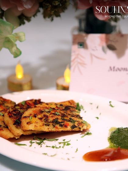 A simple yet elegant plate of Moonglate, a savory pancake, served with traditional chutneys. This dish highlights our ability to perfect and present even the most classic wedding breakfast items.