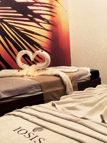 Our couples massage room is a private sanctuary designed for shared relaxation. It's the perfect setting to reconnect with a loved one while our therapists work to melt away your stress in a serene, candlelit ambiance.