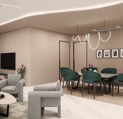 An open-plan living and dining concept for SVASA 2A, where a cohesive beige color scheme unifies the space. A bold green sofa and matching dining chairs add a touch of vibrant energy, while a flowing ceiling detail with cove lighting connects the two zones.