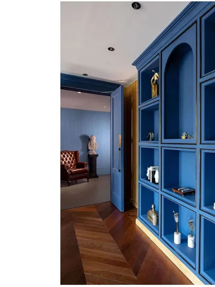 A bold blue display niche at Paras Healthcare adds a vibrant pop of color to the otherwise neutral palette. This space, leading to a private office, showcases our use of color to define zones and create visual interest.