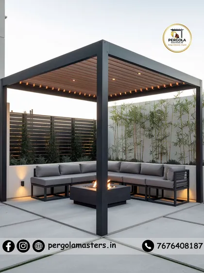 This freestanding rafter pergola creates a focal point in the courtyard. The combination of a dark metal frame, a light wood-finish ceiling, and a central fire pit results in a sophisticated and inviting gathering spot.