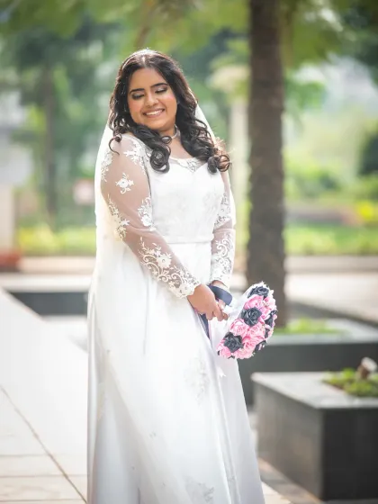 A joyful, candid portrait of the bride. Her radiant smile says everything about how she feels on her special day.