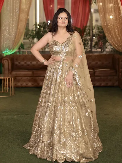 A confident pose, her hand on her hip, looking ready to enjoy the wedding festivities.