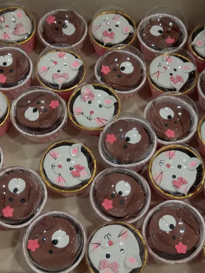 These adorable cat and puppy themed cupcakes were made to accompany a larger cake. They are perfect for animal lovers and make great individual treats for party guests.