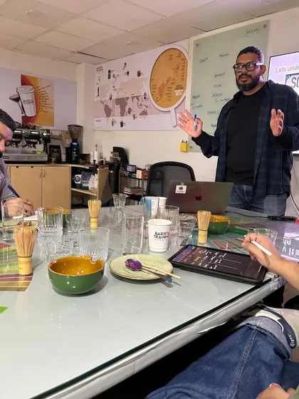 Beyond coffee, we offer specialized training. Here I am leading a Matcha Masterclass, expanding our students' skills to include other popular cafe offerings.
