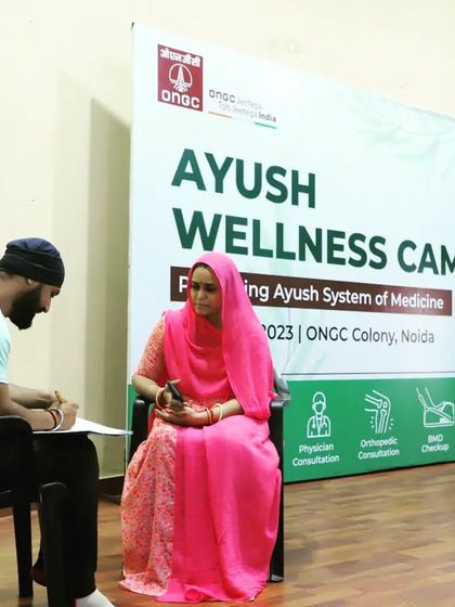 A one-on-one consultation during the ONGC wellness camp. Taking the time to listen to each person's history is the most important step in creating an effective yoga therapy plan.