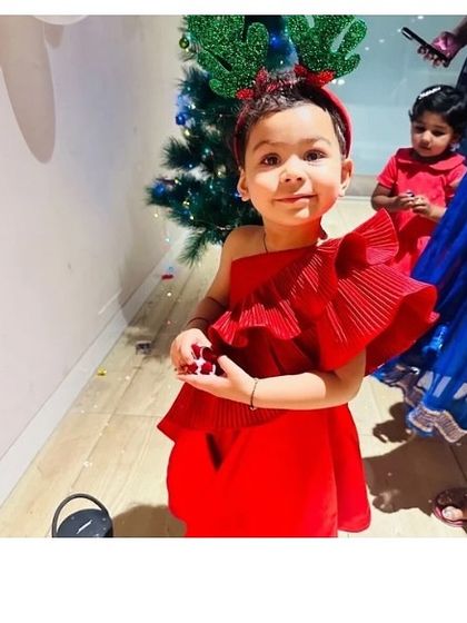 Christmas party ready in our "Red Desire" dress. The vibrant red is perfect for the holidays, and the playful ruffles add a festive touch.