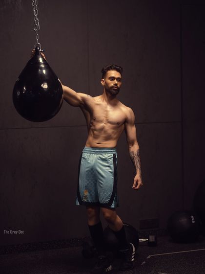 A powerful shot of me with a punching bag, captioned "Focused and fierce." This image embodies the mental strength that comes with physical training.