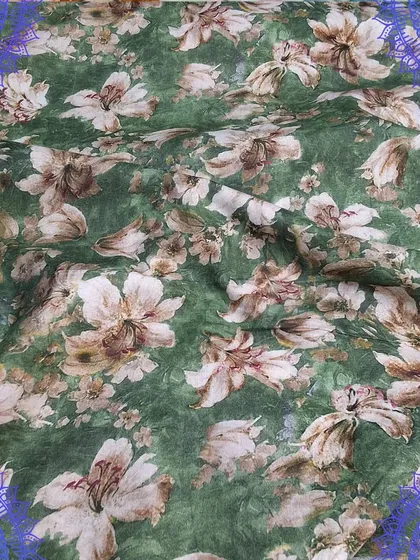 A lovely green cotton fabric with a delicate white floral digital print. The fabric is soft and has a beautiful drape, making it perfect for custom dresses.