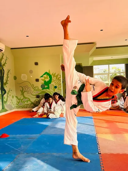 This student shows great potential with a high and powerful side kick, a testament to his hard work and our training methods.