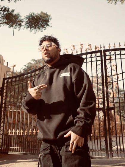 In front of the gates, ready for whatever comes next. The attitude is always confident.