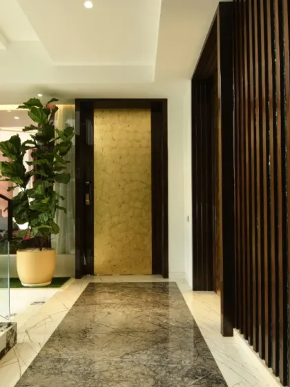 Additional views showcasing the interplay of glass walls, marble floors, and wooden slat details. These images highlight how we use materials to define spaces and create visual continuity.