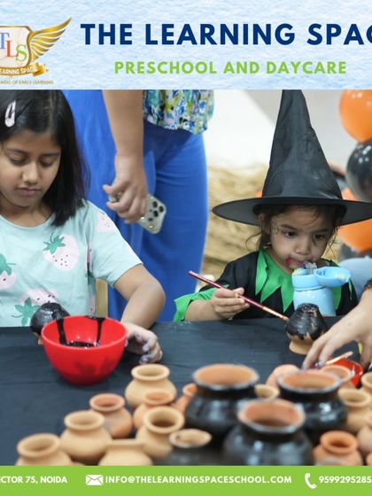 A young witch carefully paints a clay pot, one of the many creative stations at our Halloween event. These activities allow children to express their artistic side.