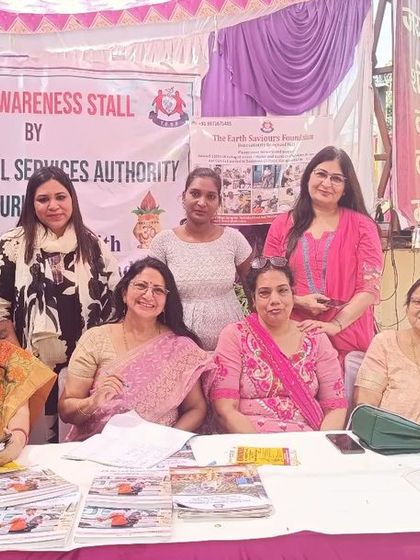 The full team of women advocates and volunteers at the DLSA stall. We are a strong force for justice and empowerment in our community.