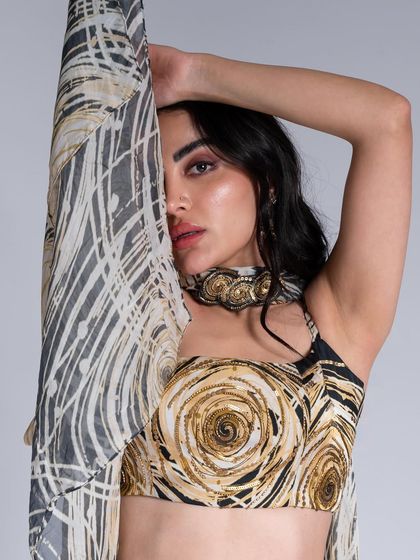 A close-up of the makeup for this abstract-print top. The eye makeup has a soft, diffused smokey effect that complements the colors in the outfit.