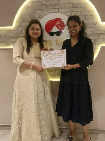 A proud moment presenting a certificate of completion to my talented student.