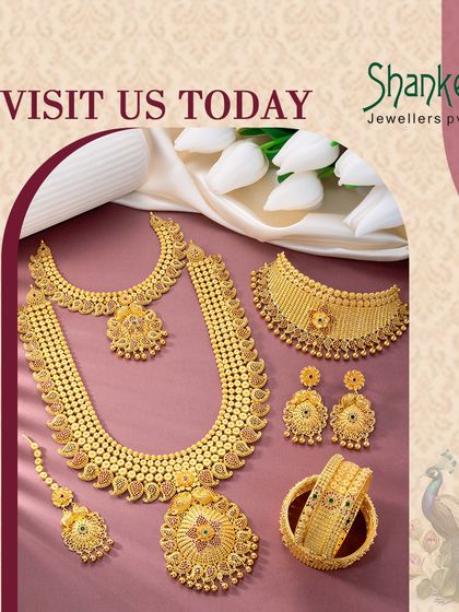 A complete bridal ensemble laid out to display its grandeur. This set includes a choker, a long necklace, matching earrings, a maang tikka, and bangles, representing a full-package solution for retailers.