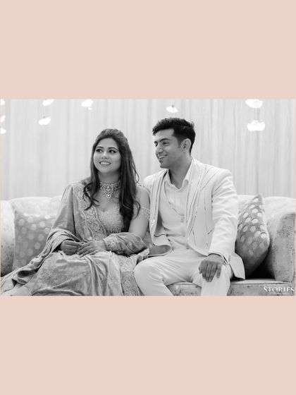 A simple and sweet black and white portrait of the couple seated together during their engagement ceremony.
