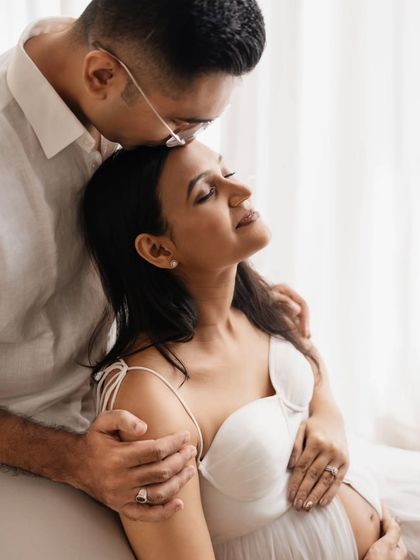 Such a sweet and loving gesture. A kiss on the forehead is one of my favorite prompts for couples. It creates such a natural and emotional moment, perfect for a maternity photoshoot.