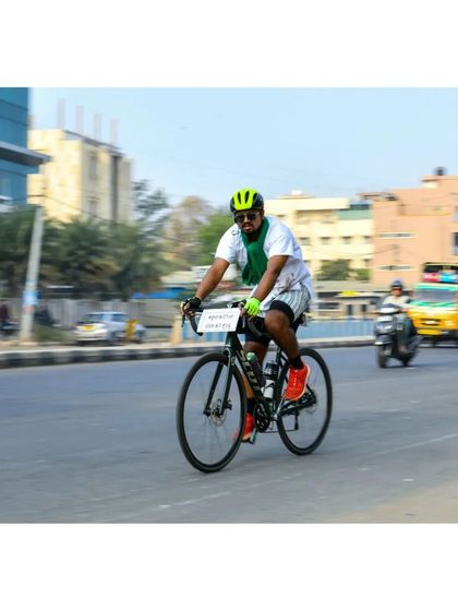 A participant from the farmer-themed team cycles through the streets of Bangalore during the Treasure Hunt, bringing a unique and important message to the city.