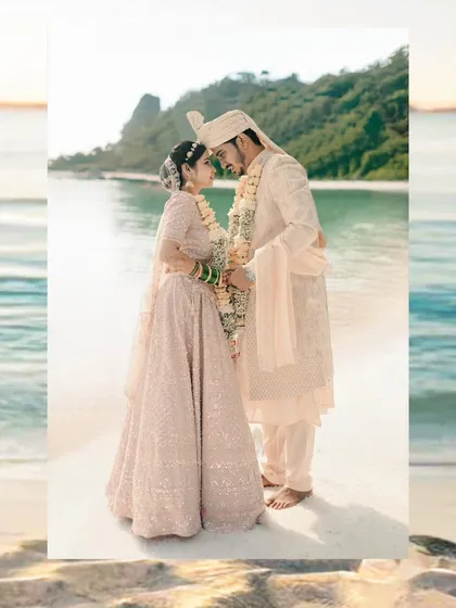 A creative edit of a beach wedding portrait, framed to emphasize the beautiful sea and sky, making it perfect for a wedding album.