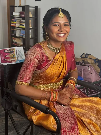 The happy, glowing smile of my beautiful bride Gopika at her engagement. I specialize in creating subtle, natural makeup for dusky skin tones, ensuring the final look is radiant and enhances her features without feeling heavy.